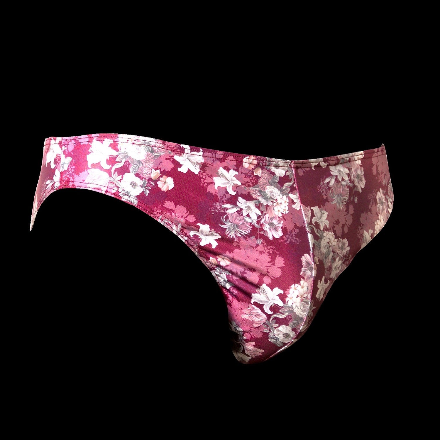 The Etseo Nature Reflex Bikini Brief Bordeaux is part of the Etseo Nature Reflex men's underwear collection of Trunks and Bikini Briefs. Etseo Nature Reflex is made with a very comfortable shiny and elastic fabric printed with modern floral patterns. At Etseo we manufacture quality men's underwear.