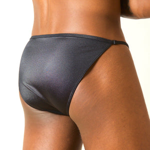 The Etseo Reflex Bikini Tanga Black is part of the Etseo Reflex Men's Underwear Collection of Boxer Briefs and Bikini Tangas. Etseo Reflex is an elegant and comfortable collection of products made of a glossy elastic fabric that allows a good fit to the body. At Etseo we manufacture quality men's underwear.